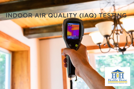 Photo an inspector's hand testing indoor air quality in a home in Orlando
